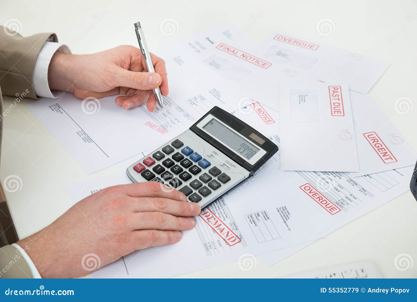 businessperson hand calculating bills
