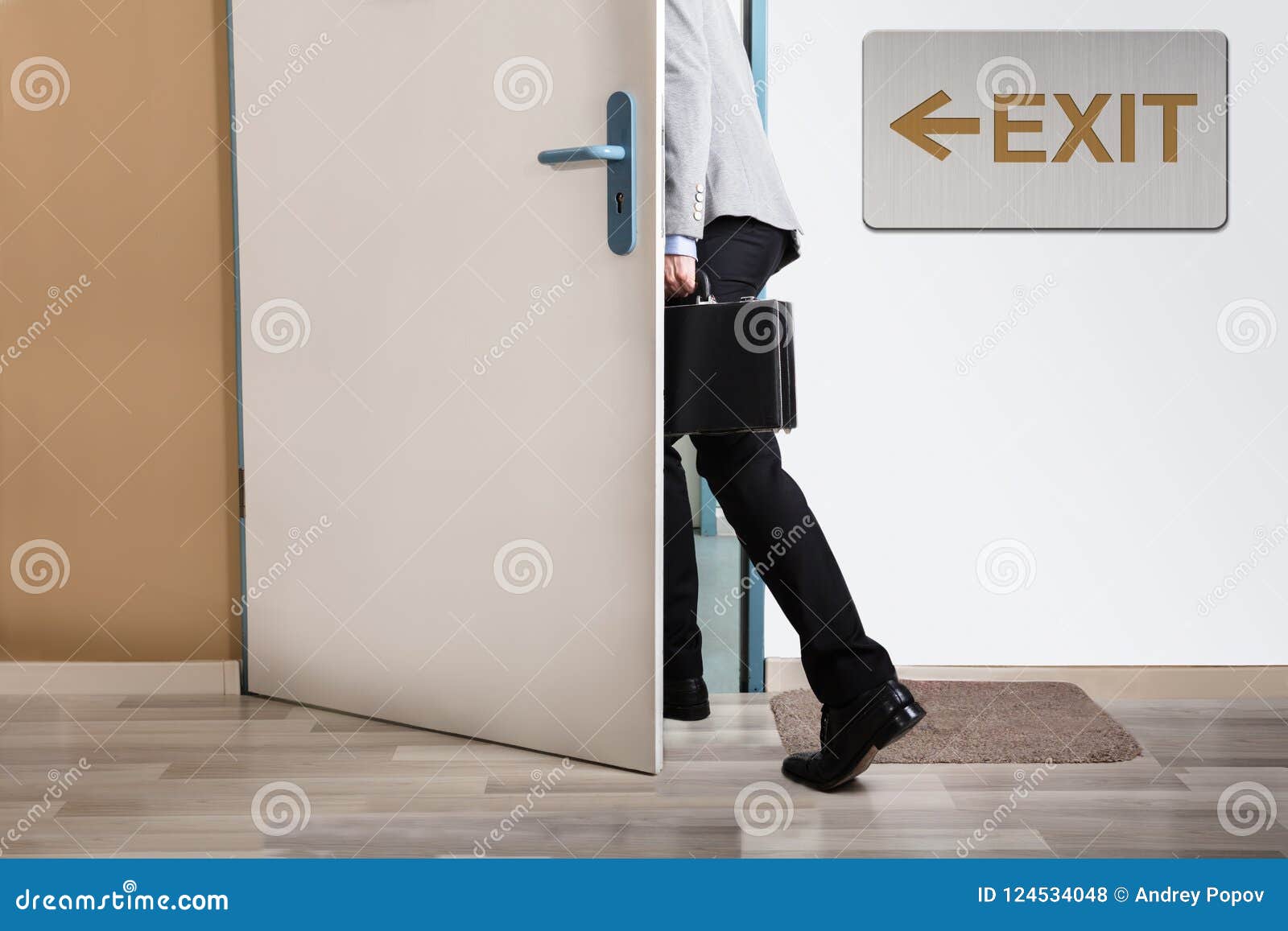 businessperson walking out
