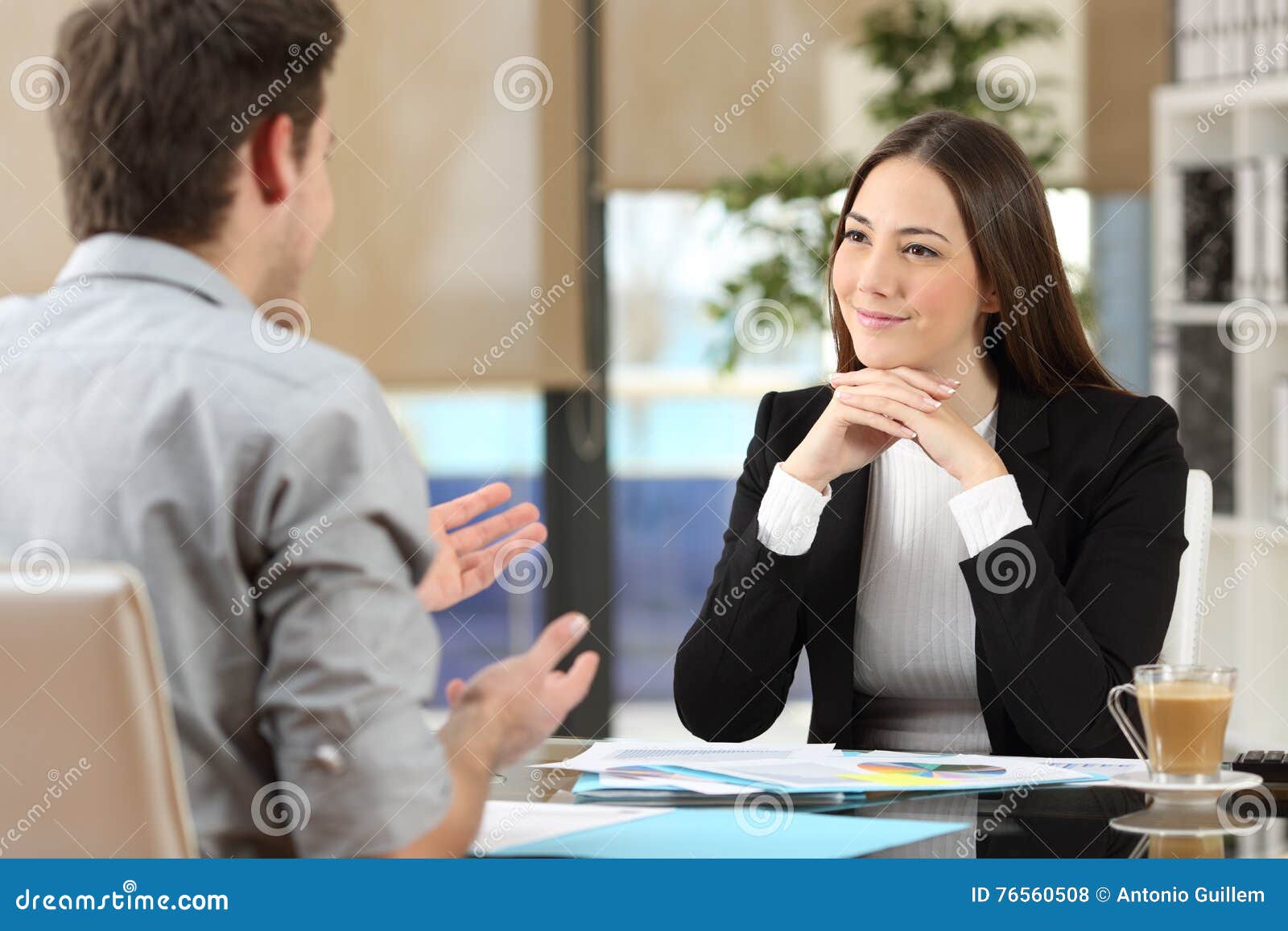 businesswoman attending a client at office