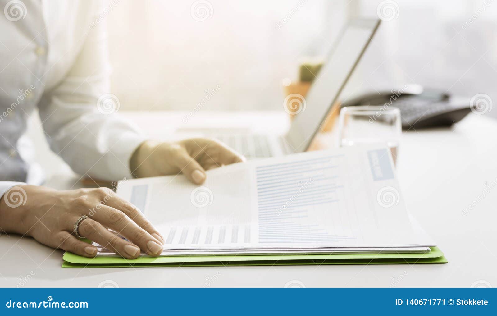 businesswoman checking financial reports and statements