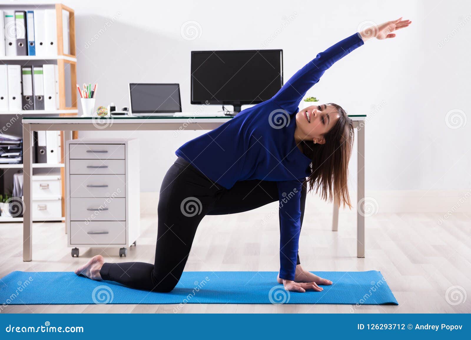 Businesswoman Doing Workout In Office Stock Photo Image Of Desk