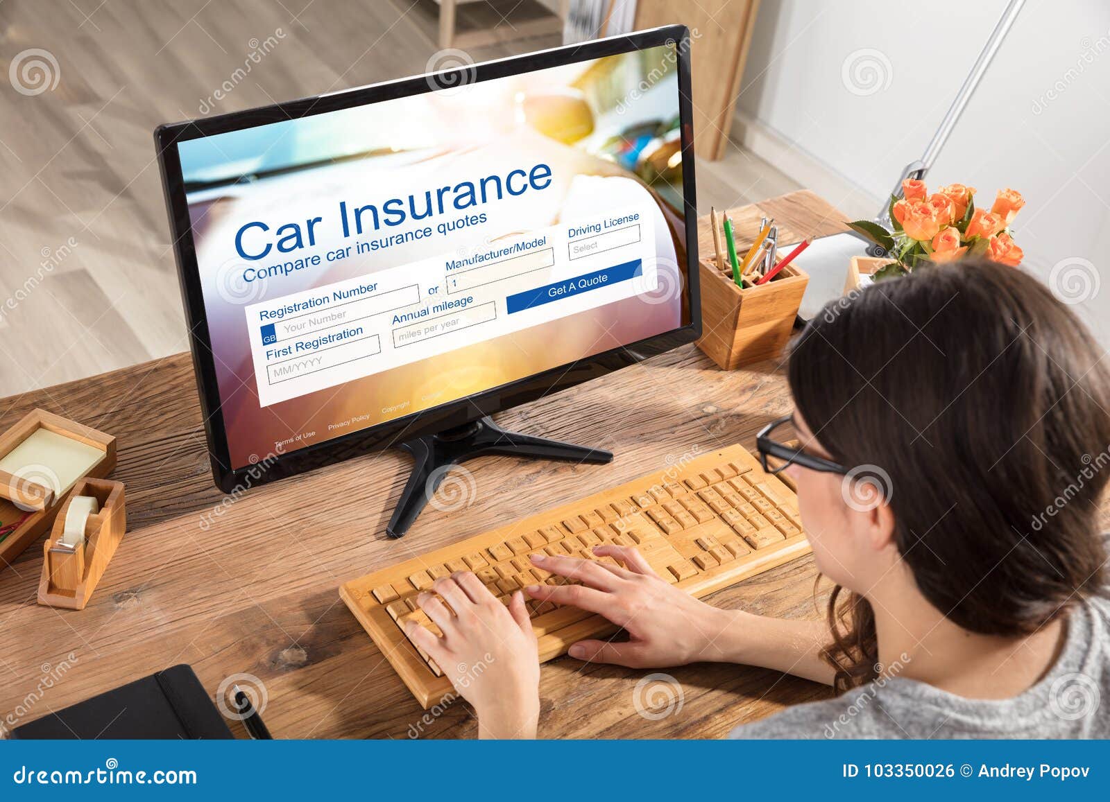 woman filling the car insurance form on computer
