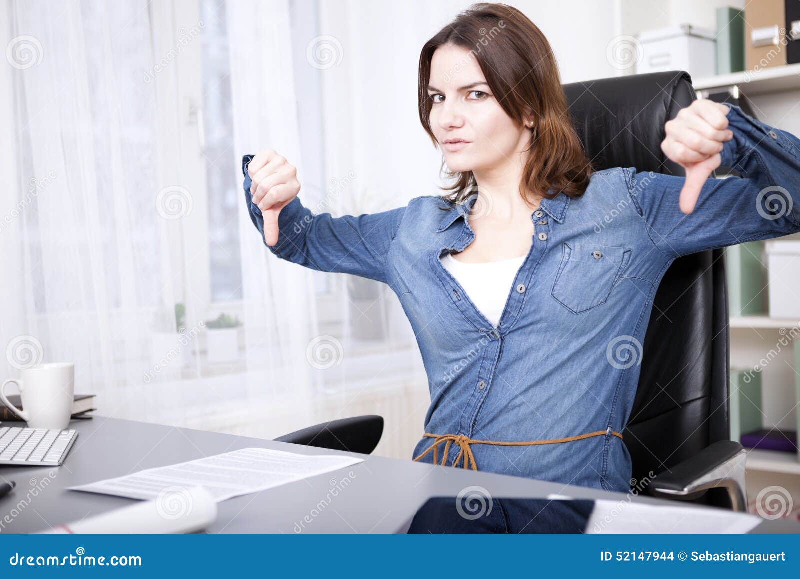 businesswoman giving an emphatic thumbs down