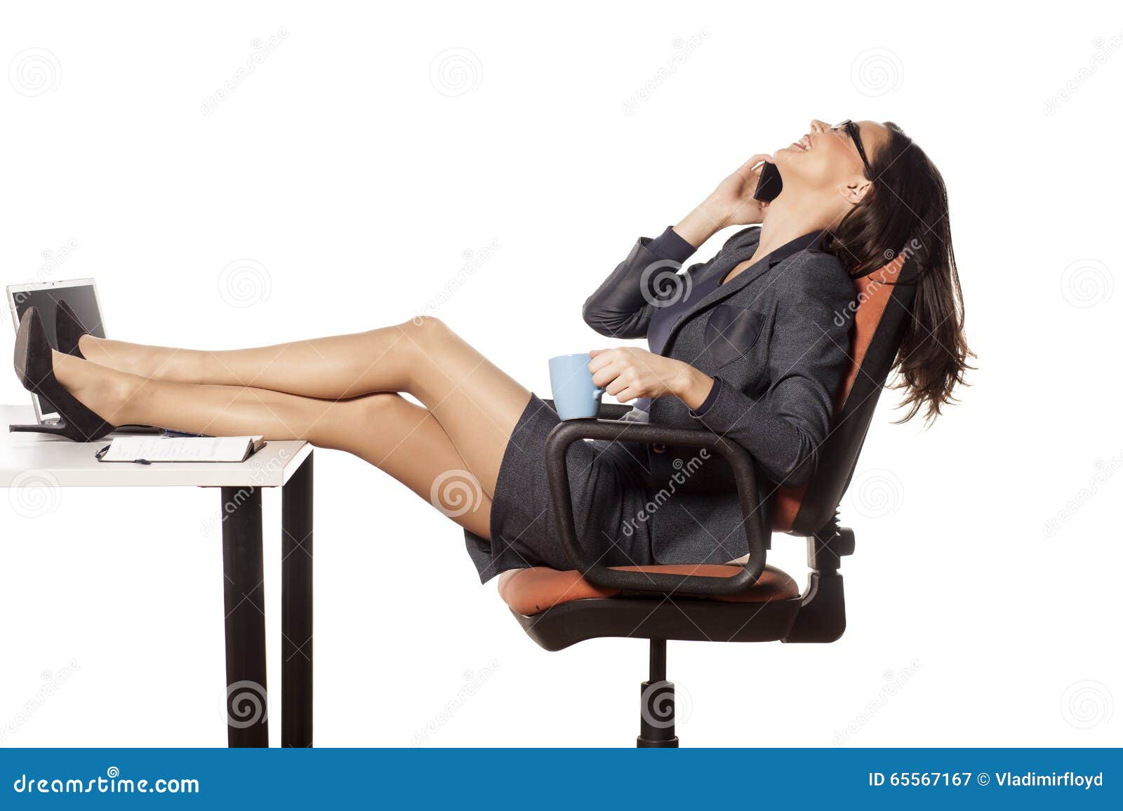 Closeup image of businesswoman resting feet under desk Stock Photo by  ©Kryzhov 193532346