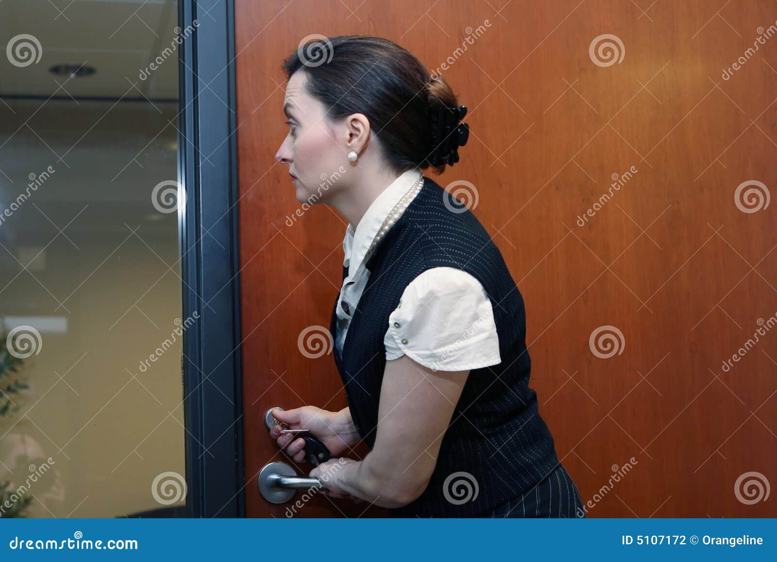 Businesswoman Locking The Door Stock Photo Image 5107172