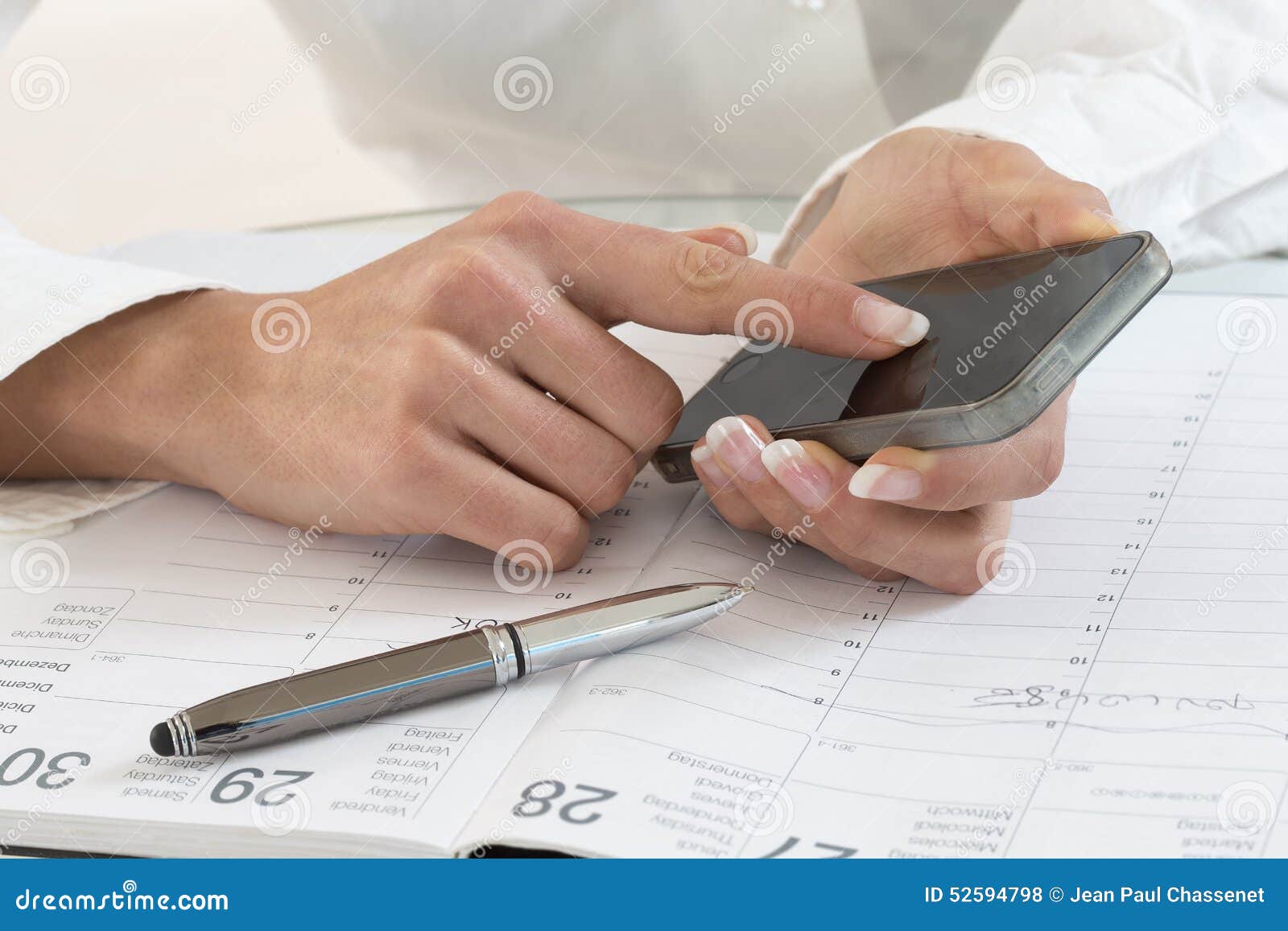 businesswoman in office noting an appointment