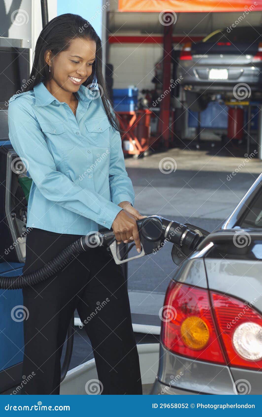 businesswoman refueling car