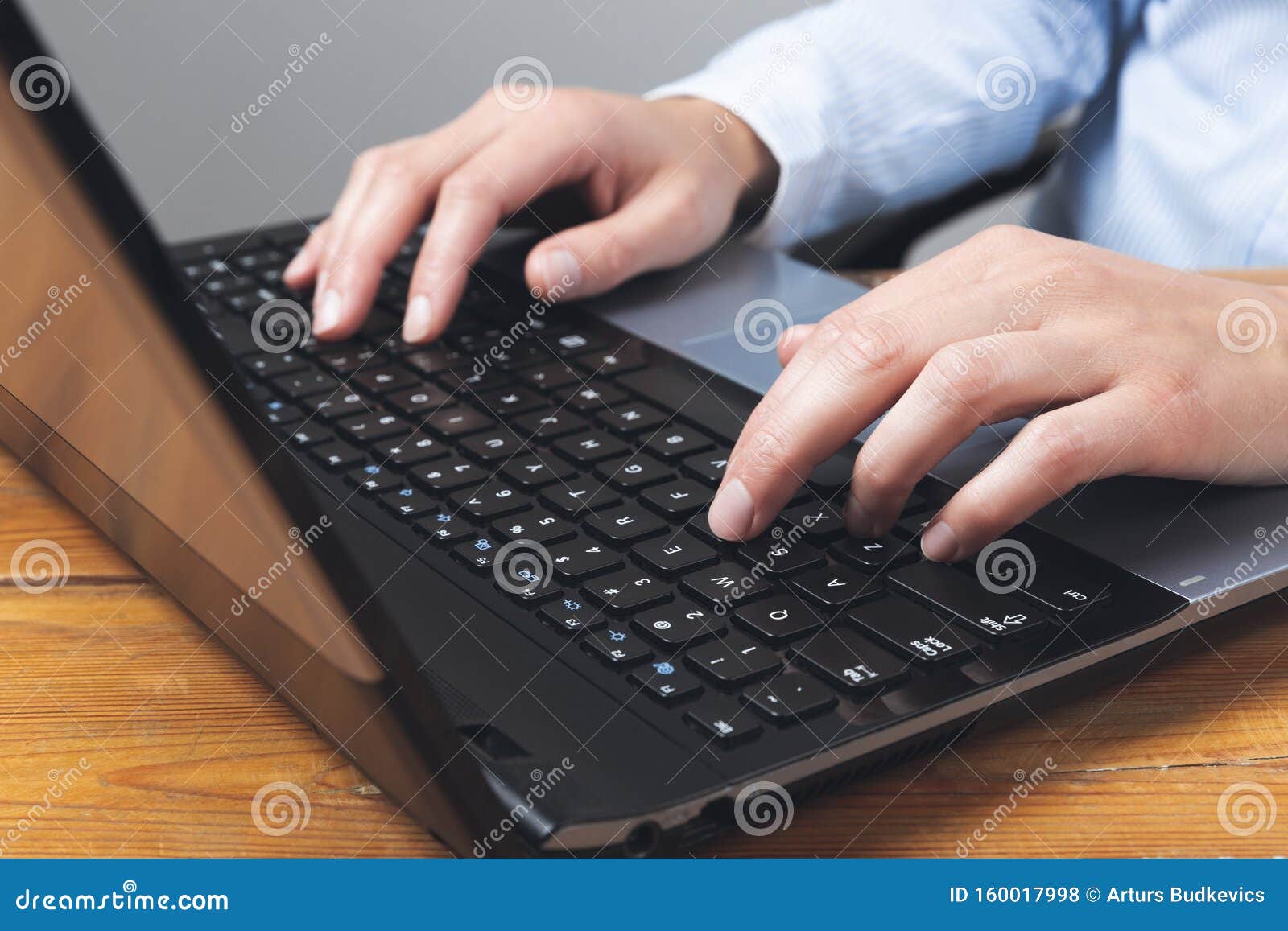 businesswoman`s hands typing on laptop keybord