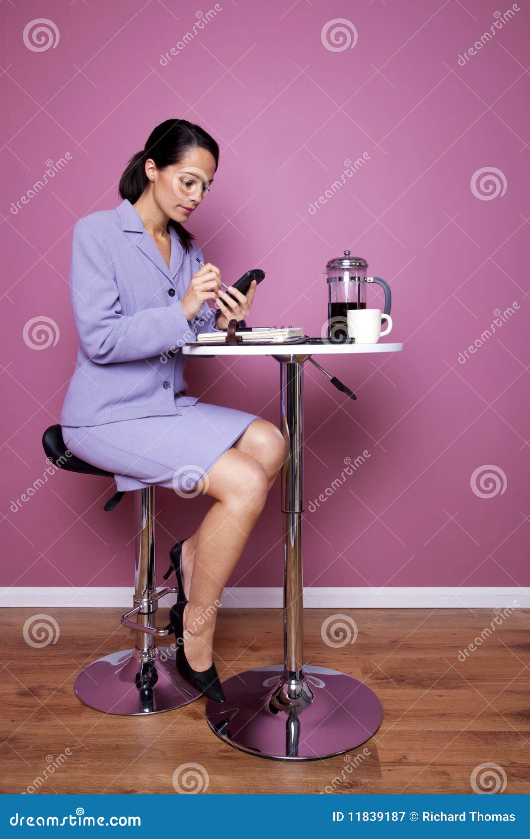businesswoman sat in a cafe working