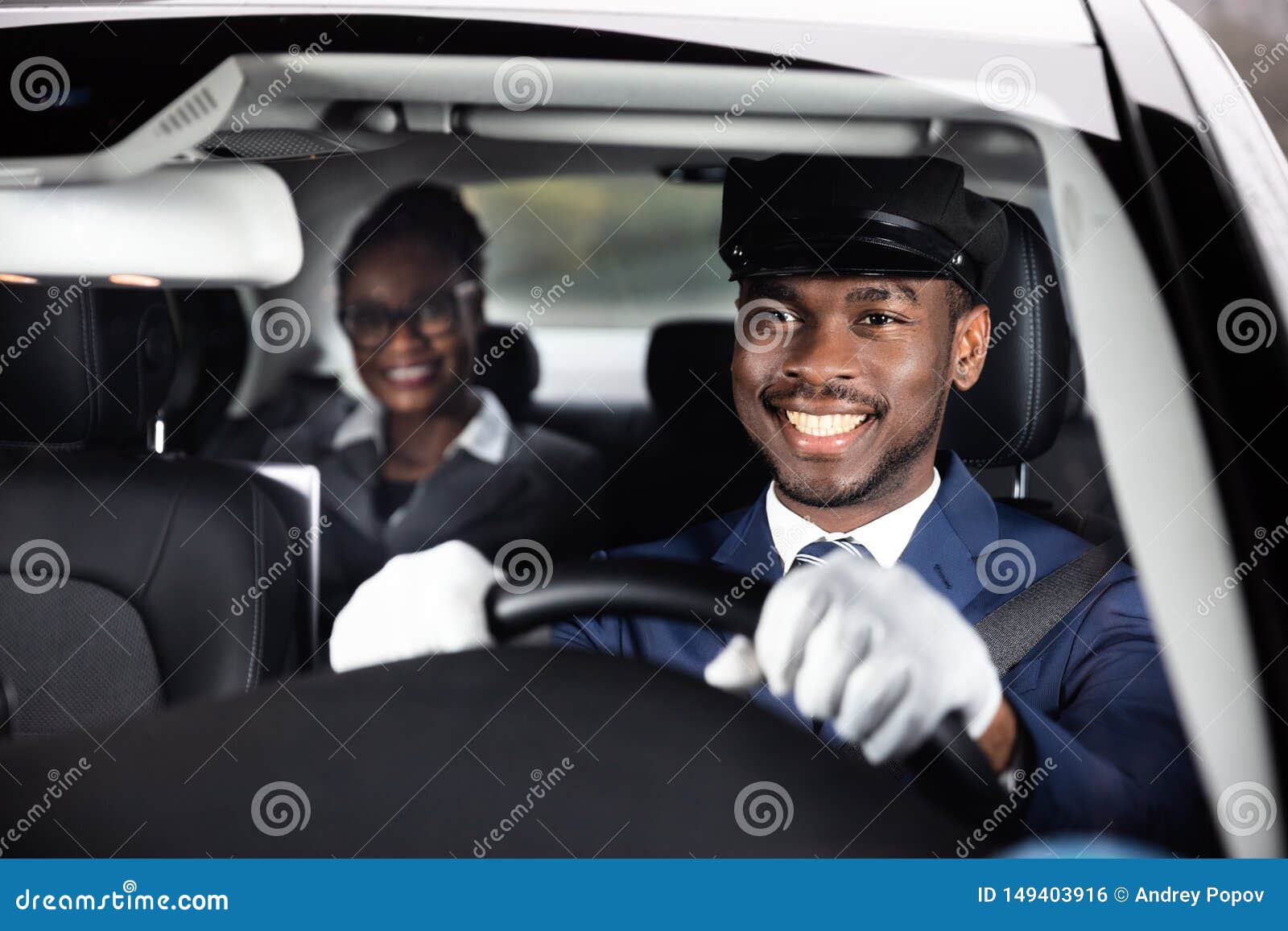 close-up of happy male chauffeur driving car