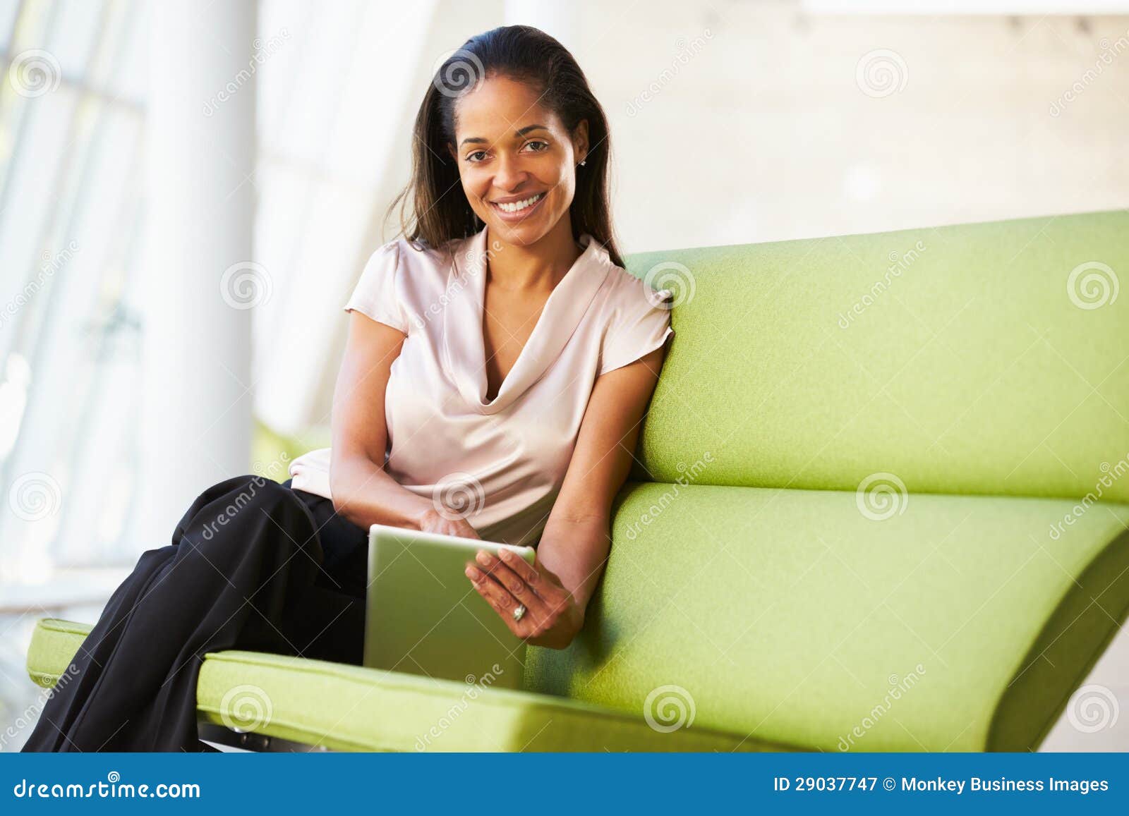 Businesswoman Sitting in Modern Office Using Digital Tablet Stock Image ...