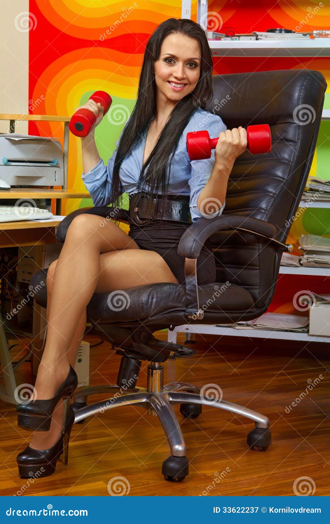businesswoman stretching with dumbbells