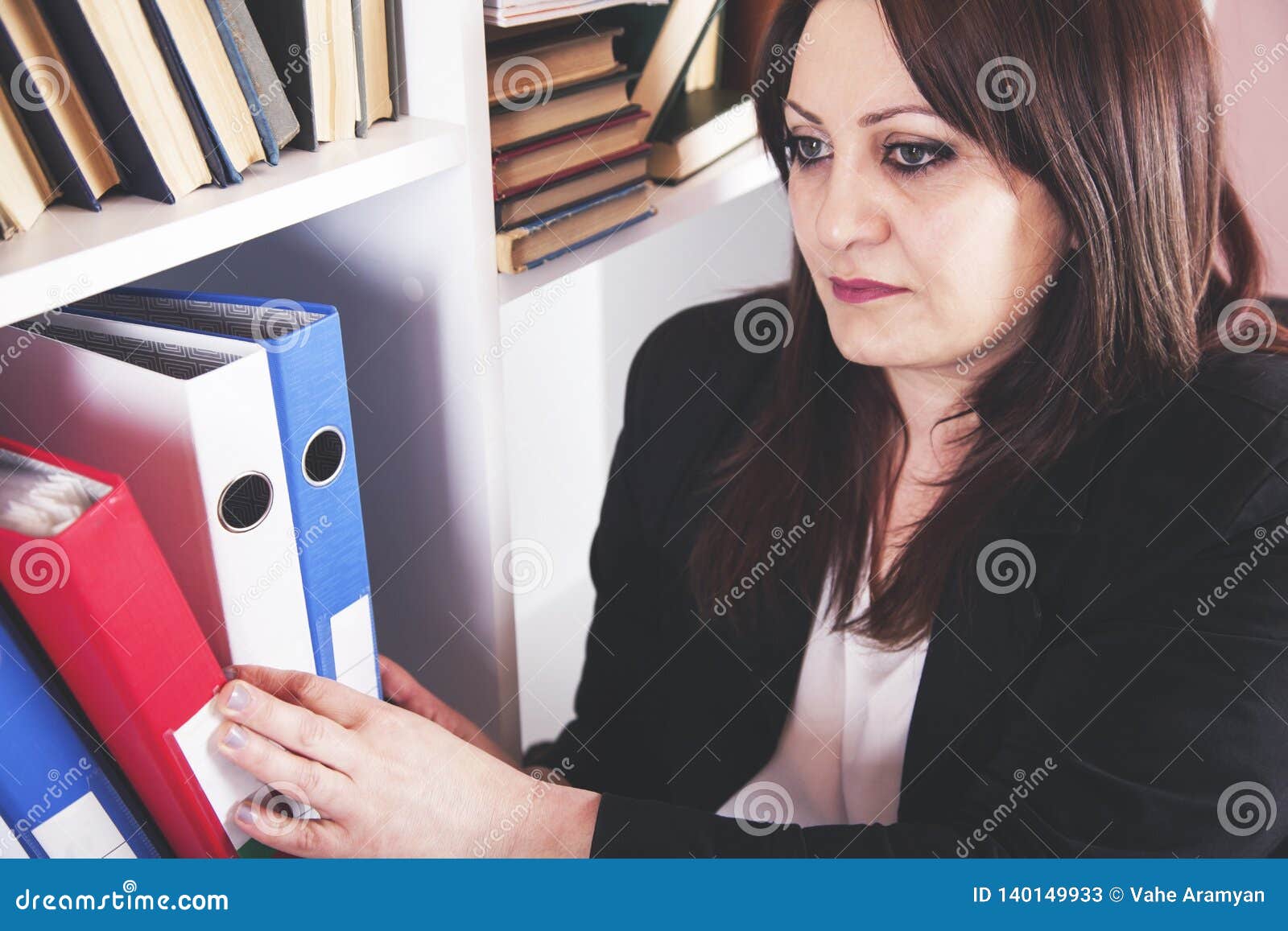 Businesswoman Taking Binders Stock Image Image of business