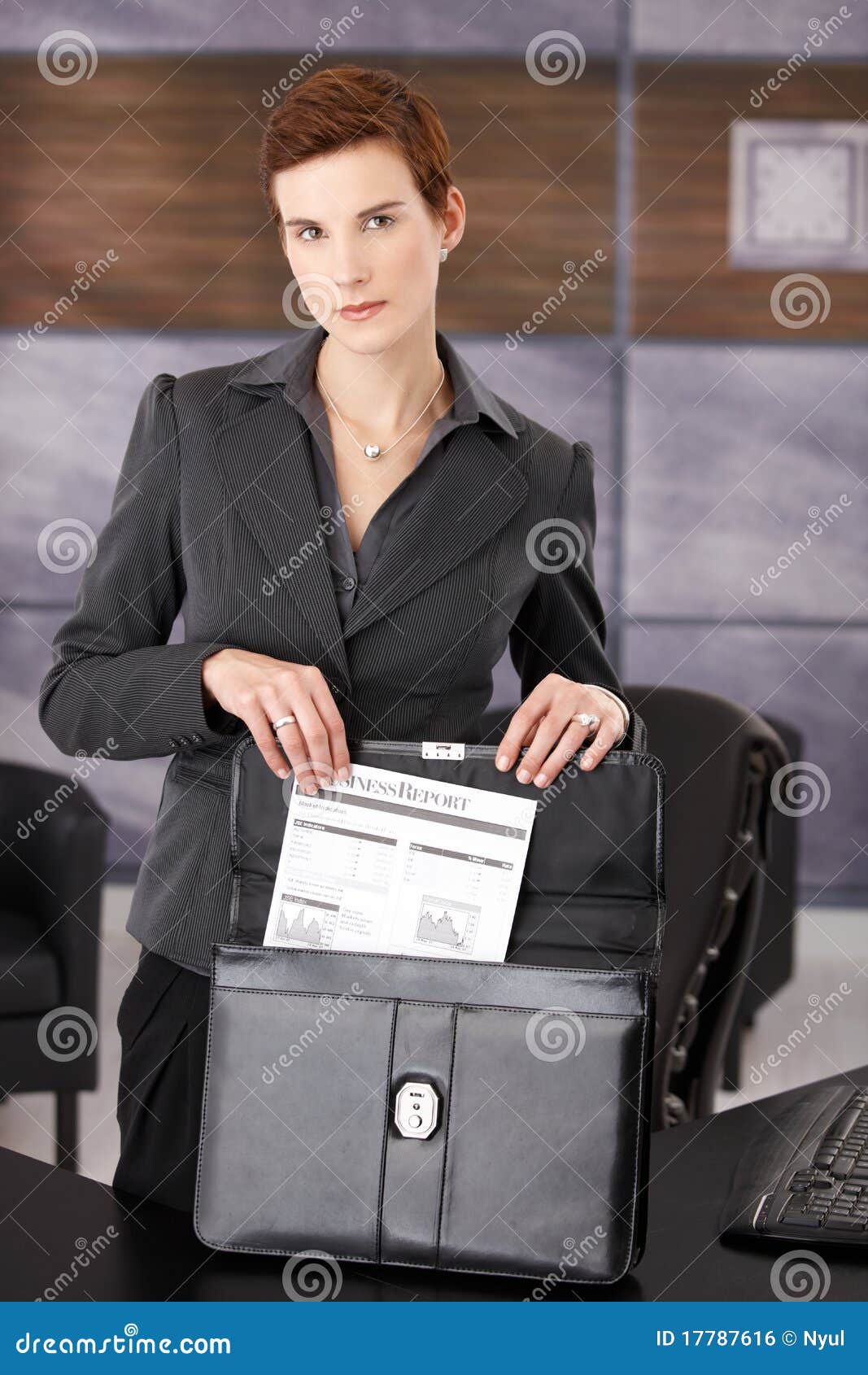 Businesswoman Taking Document from Briefcase Stock Photo - Image of ...