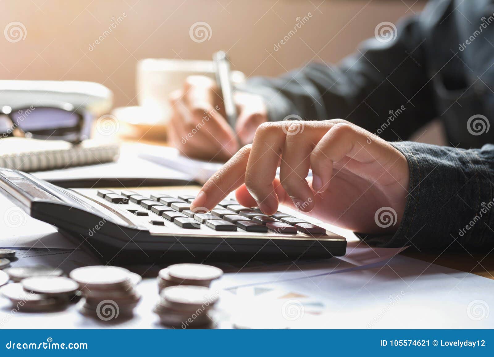 businesswoman using calculator for calculate finance accounting