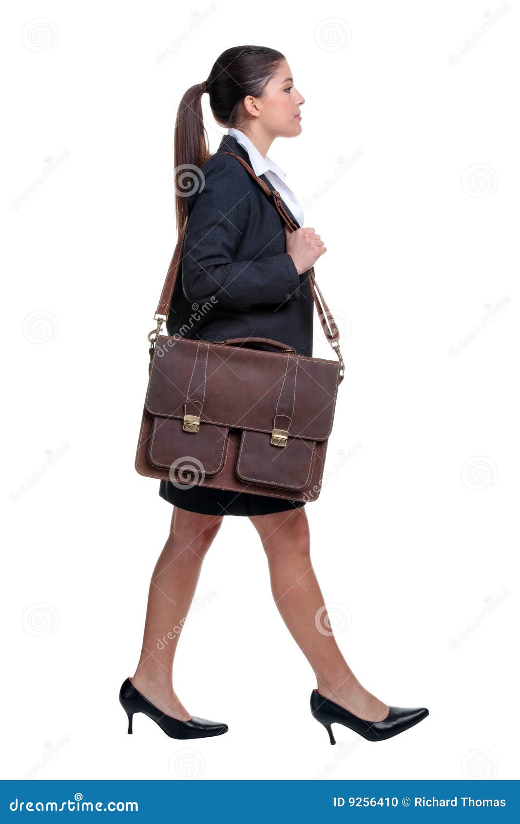 businesswoman walking with briefcase