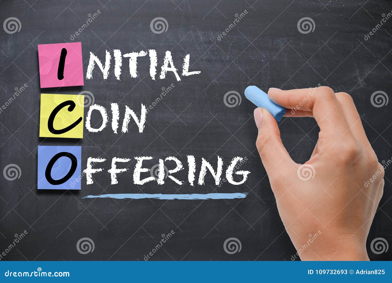 businesswoman writing ico initial coin offering on blackboard