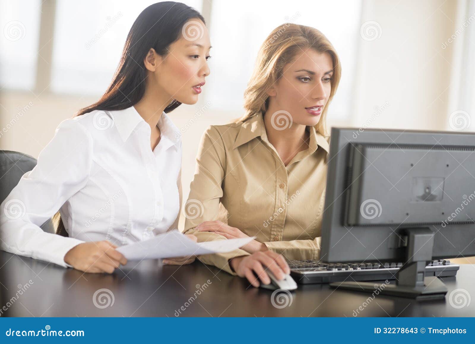 businesswomen using desktop pc