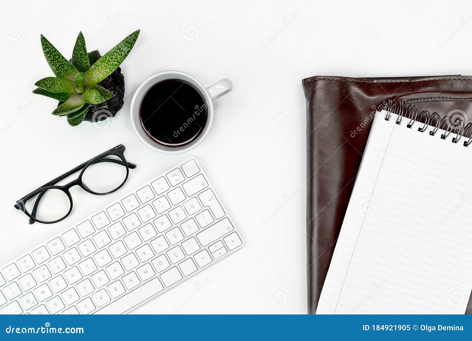 businrss or study layout. computer keyboard, glasses, coffee and laptop case. copy space flatlay.
