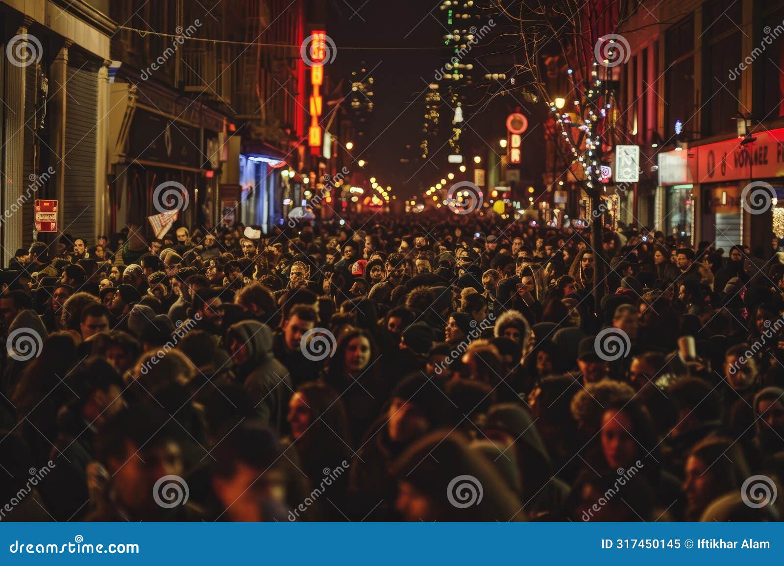 a bustling crowd of people walking down the street at night, filled with revelers and activity, a bustling crowd of revelers in