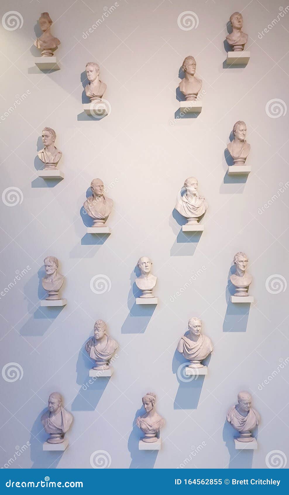 busts sculptures hanging on wall abstract