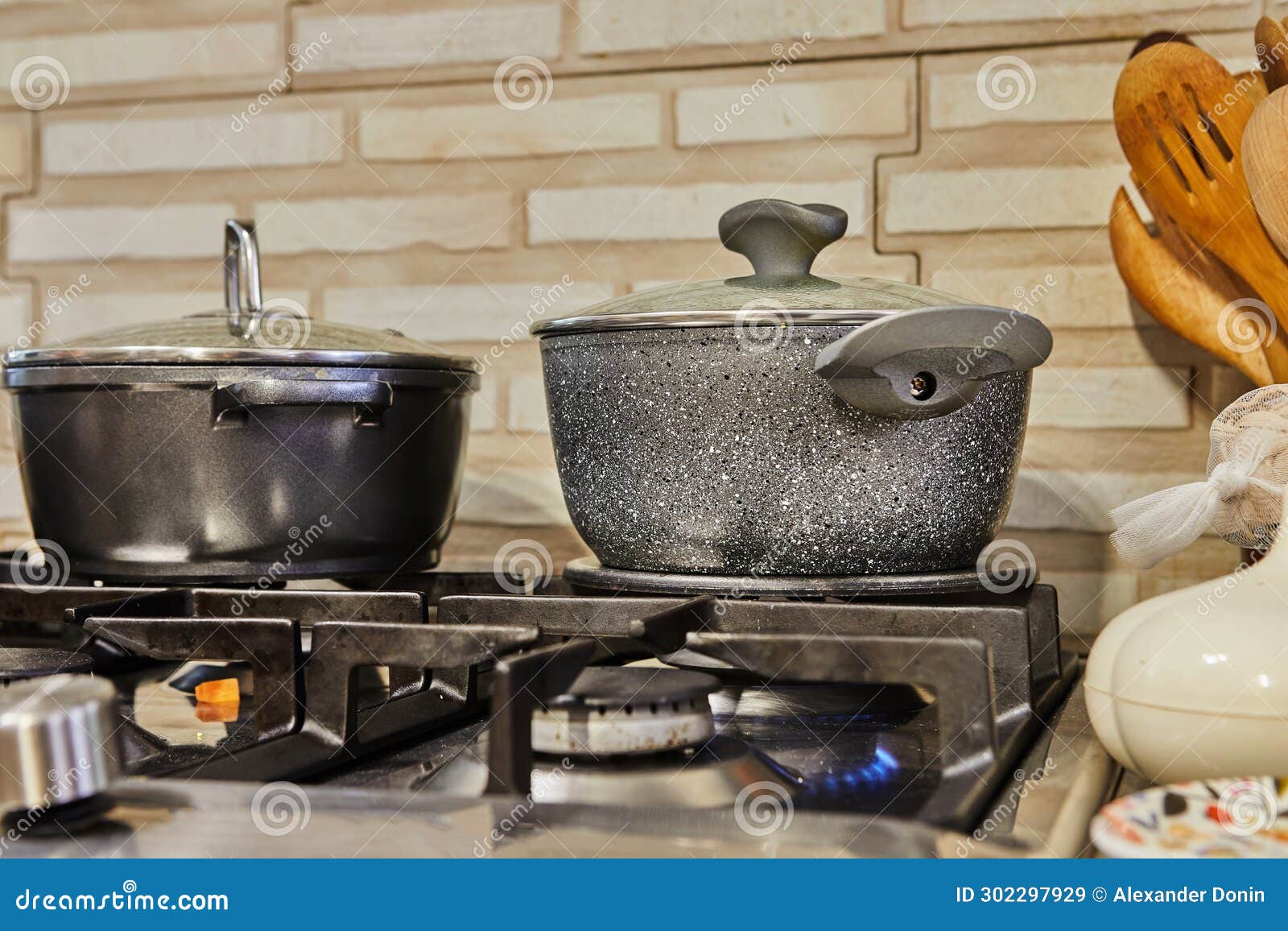 Busy Kitchen Scene with Pots, Lids, and Gas Stove Cooking Food at Home ...