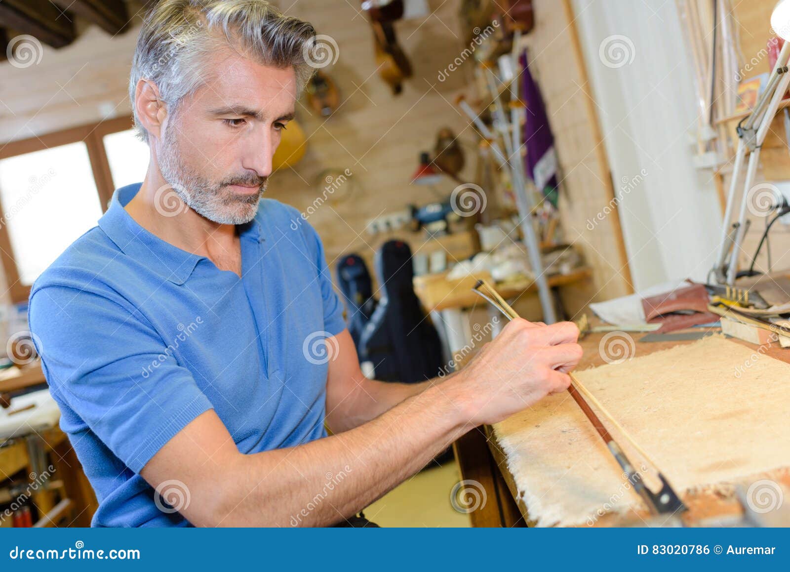 Busy luthier in stock photo. Image of duty, service 83020786