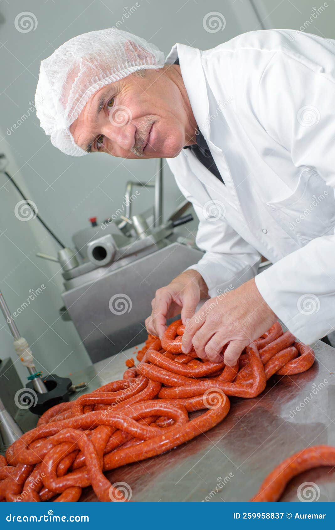 Butcher making sausages stock image. Image of male, handsome 259958837