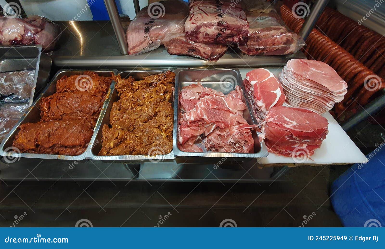 butcher shop in mexico with different types of meat on trays. typical butcher shop in latin america