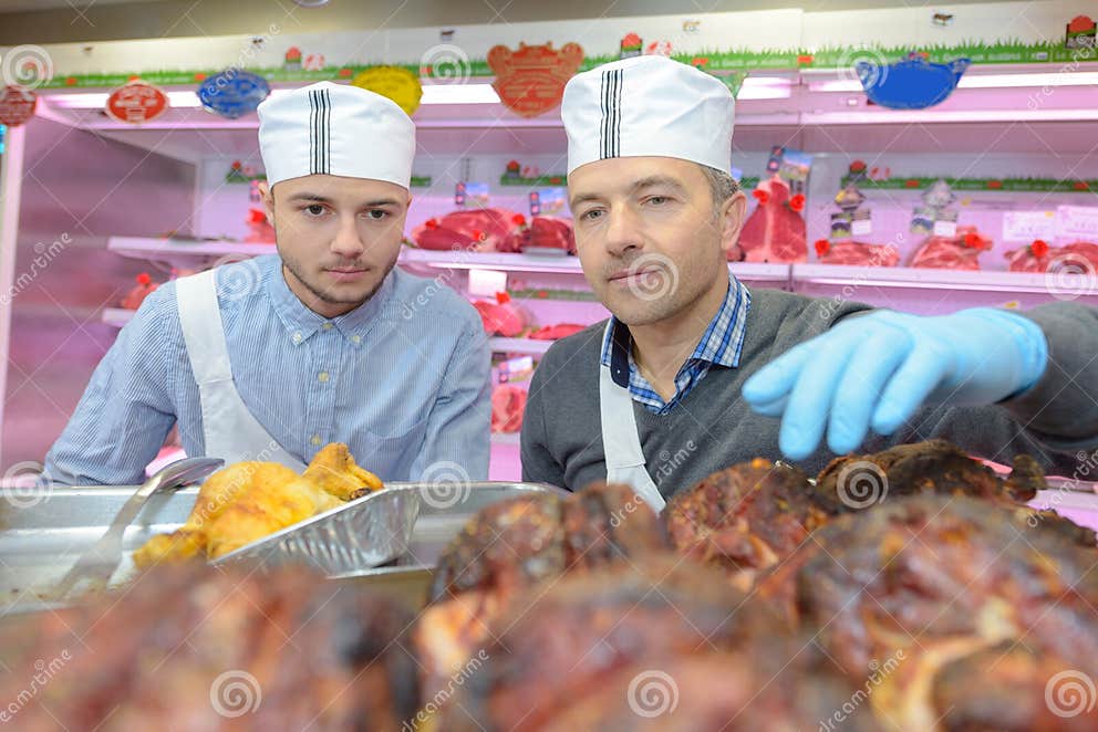 Butcher Showing Apprentice Cooked Meats Stock Photo Image of butchery