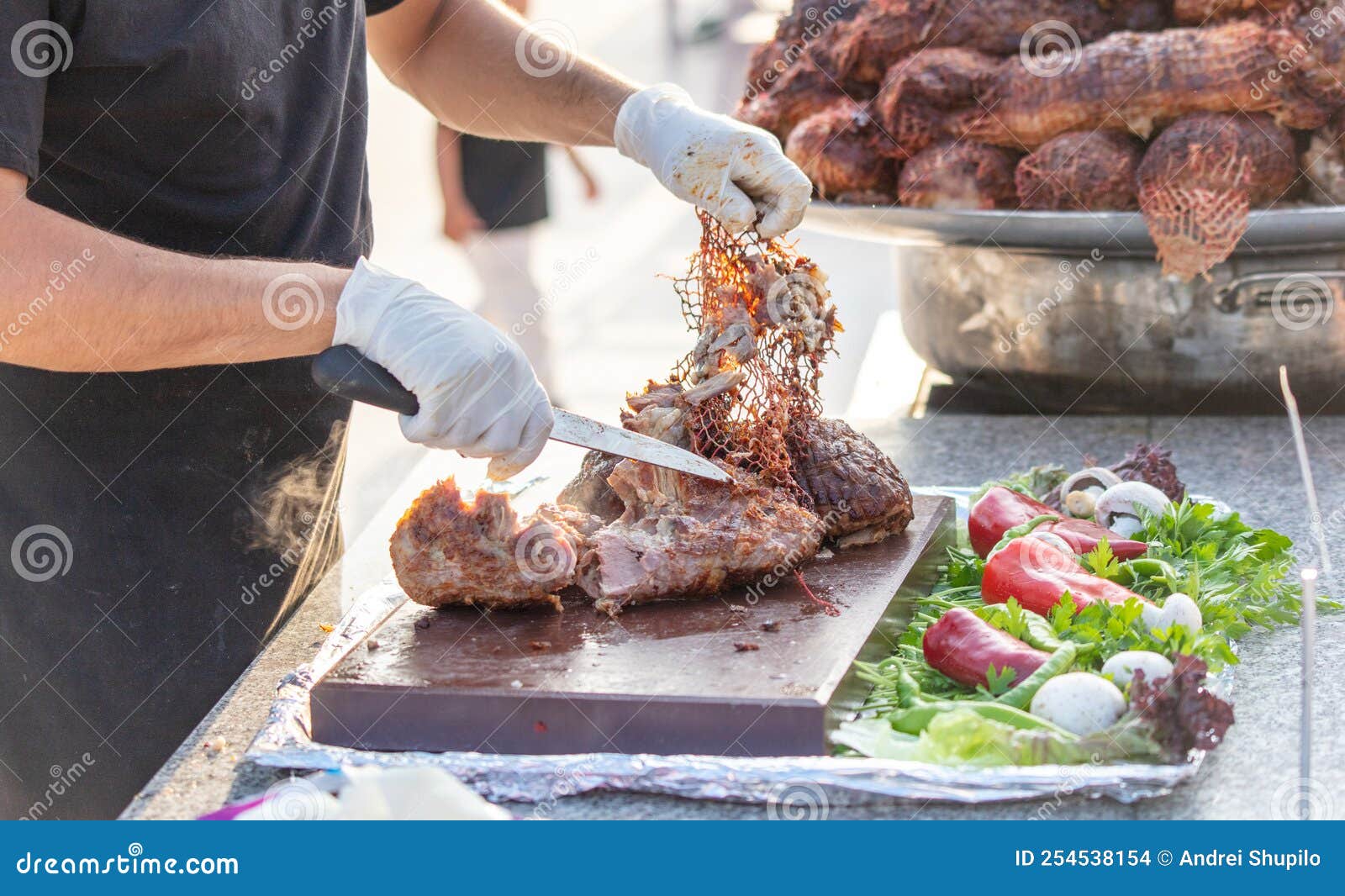 Butchering Baked Meat in a Restaurant. Stock Photo Image of recipe