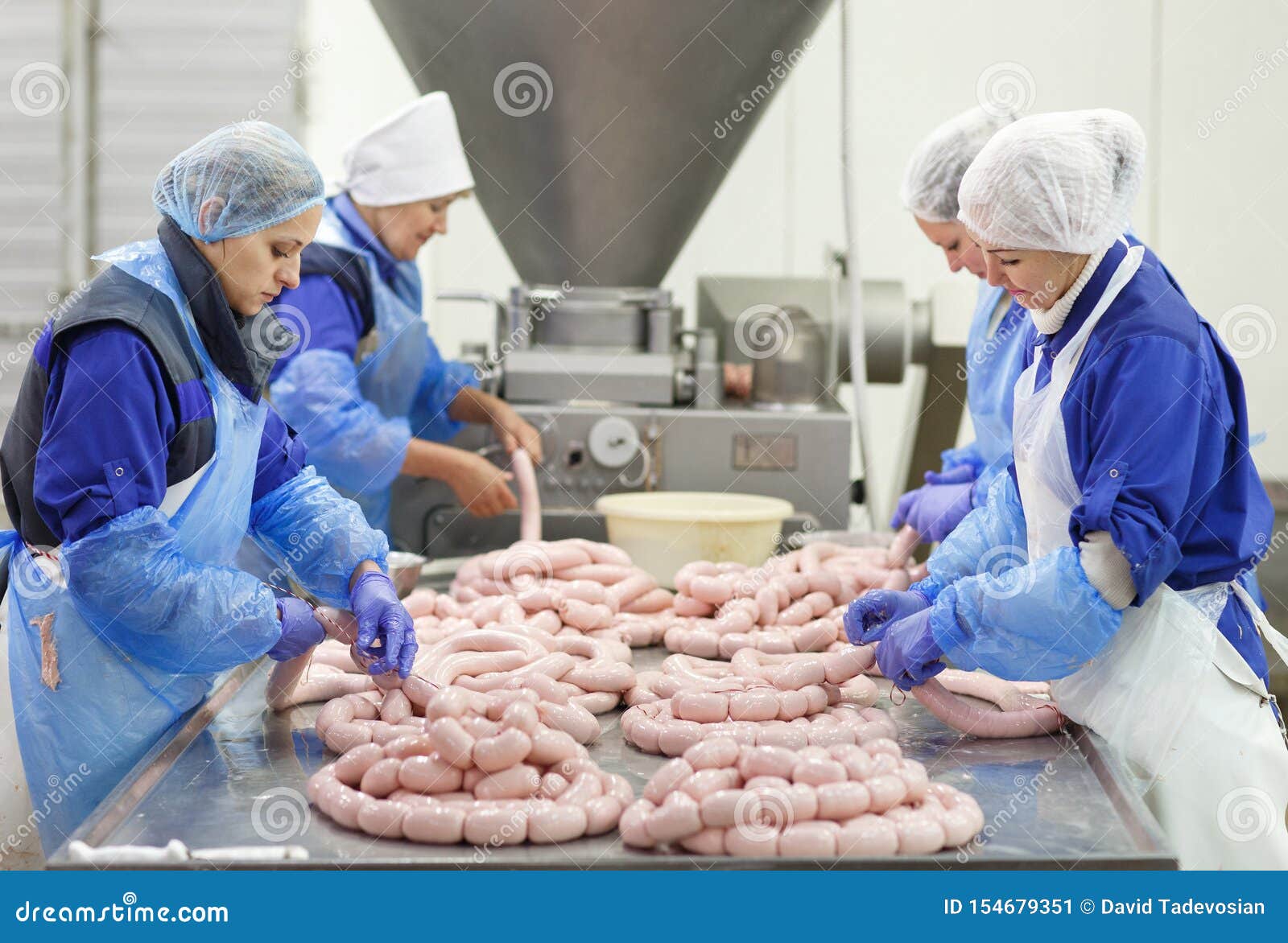 Butchers Processing Sausages at a Meat Factory Stock Image Image of