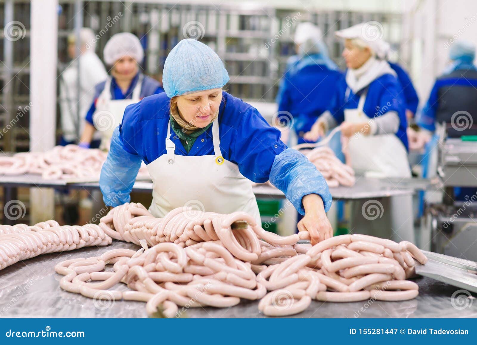 Butchers Processing Sausages at the Meat Factory. Stock Image Image