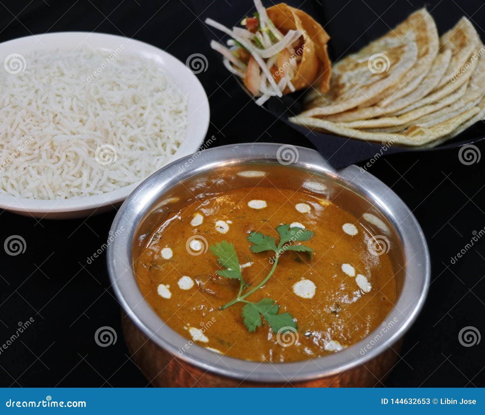 Butter Chicken Curry with Basmati Rice and Indian Bread with Black