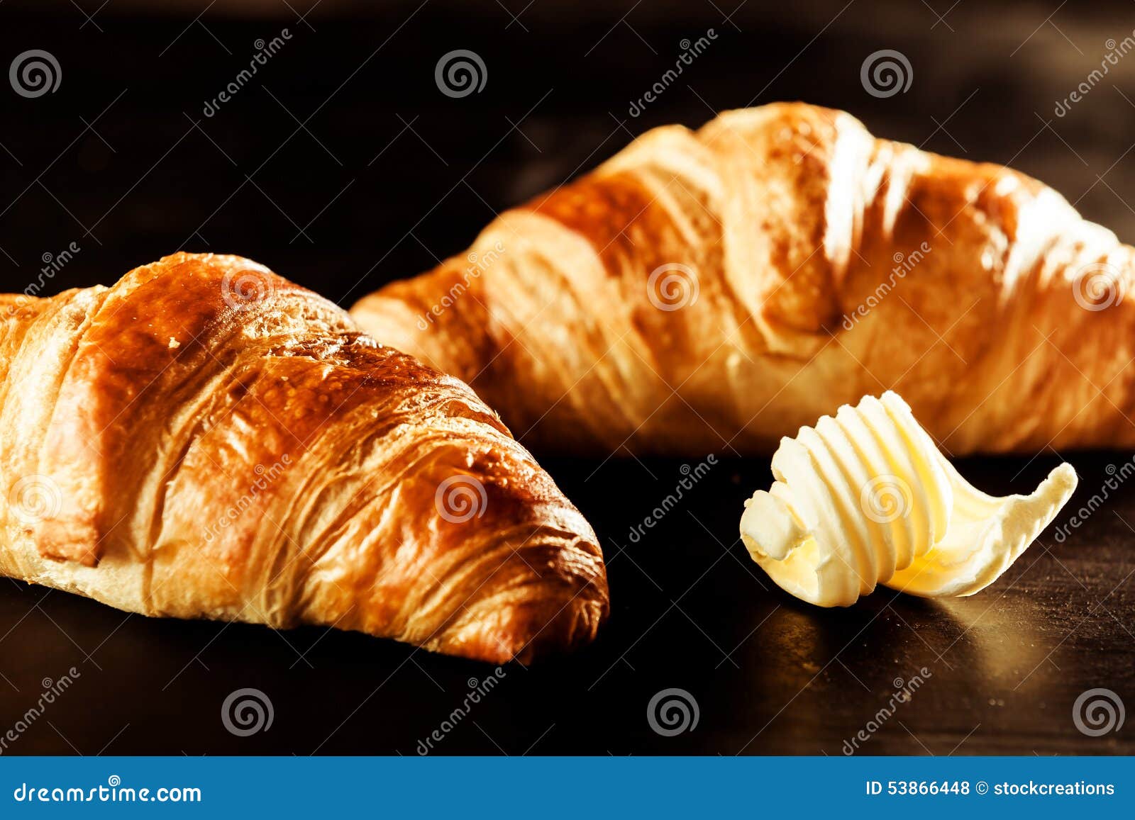 butter and croissant bread on top of a table