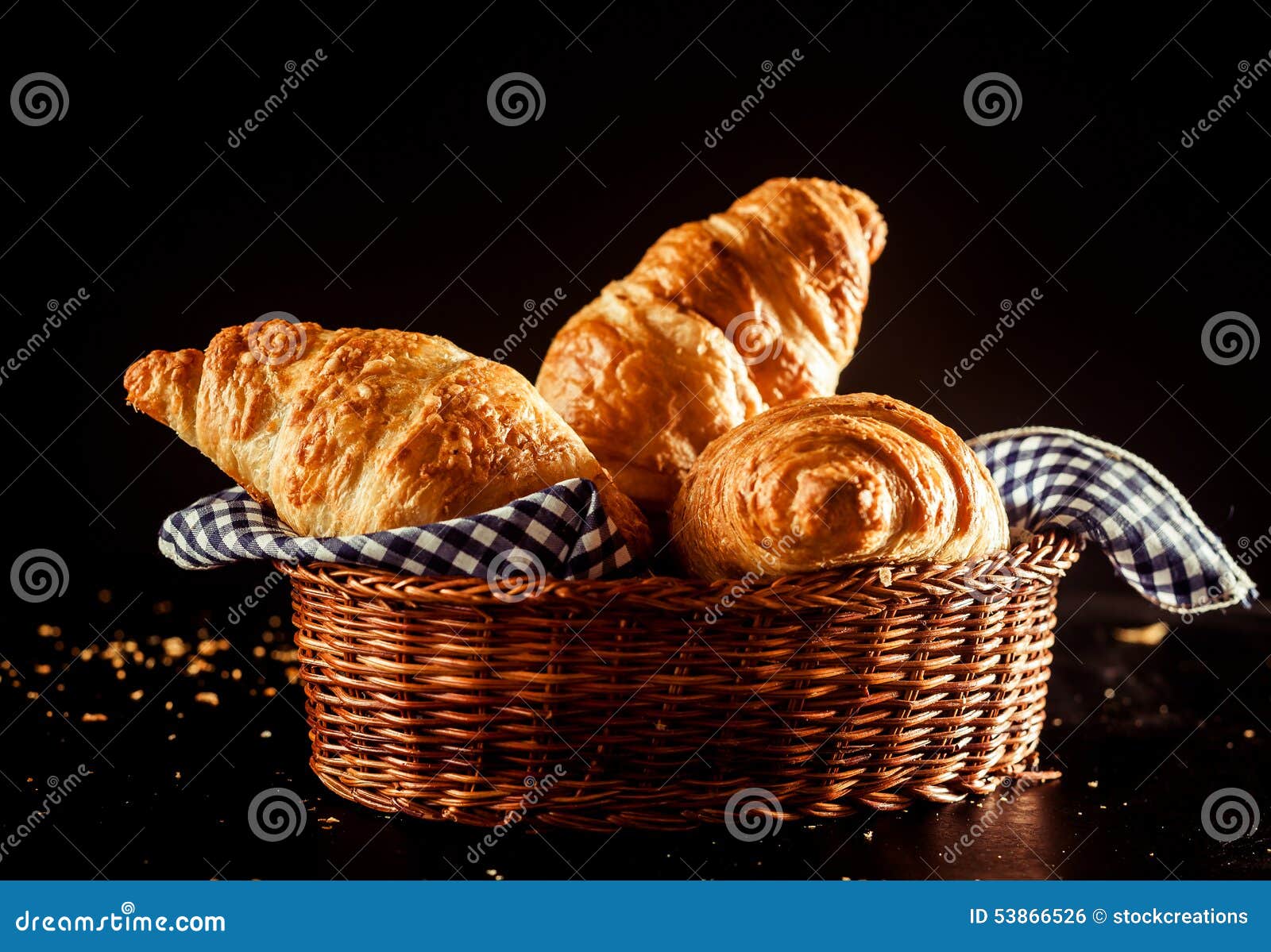 buttery and flaky croissant on a basket on a table