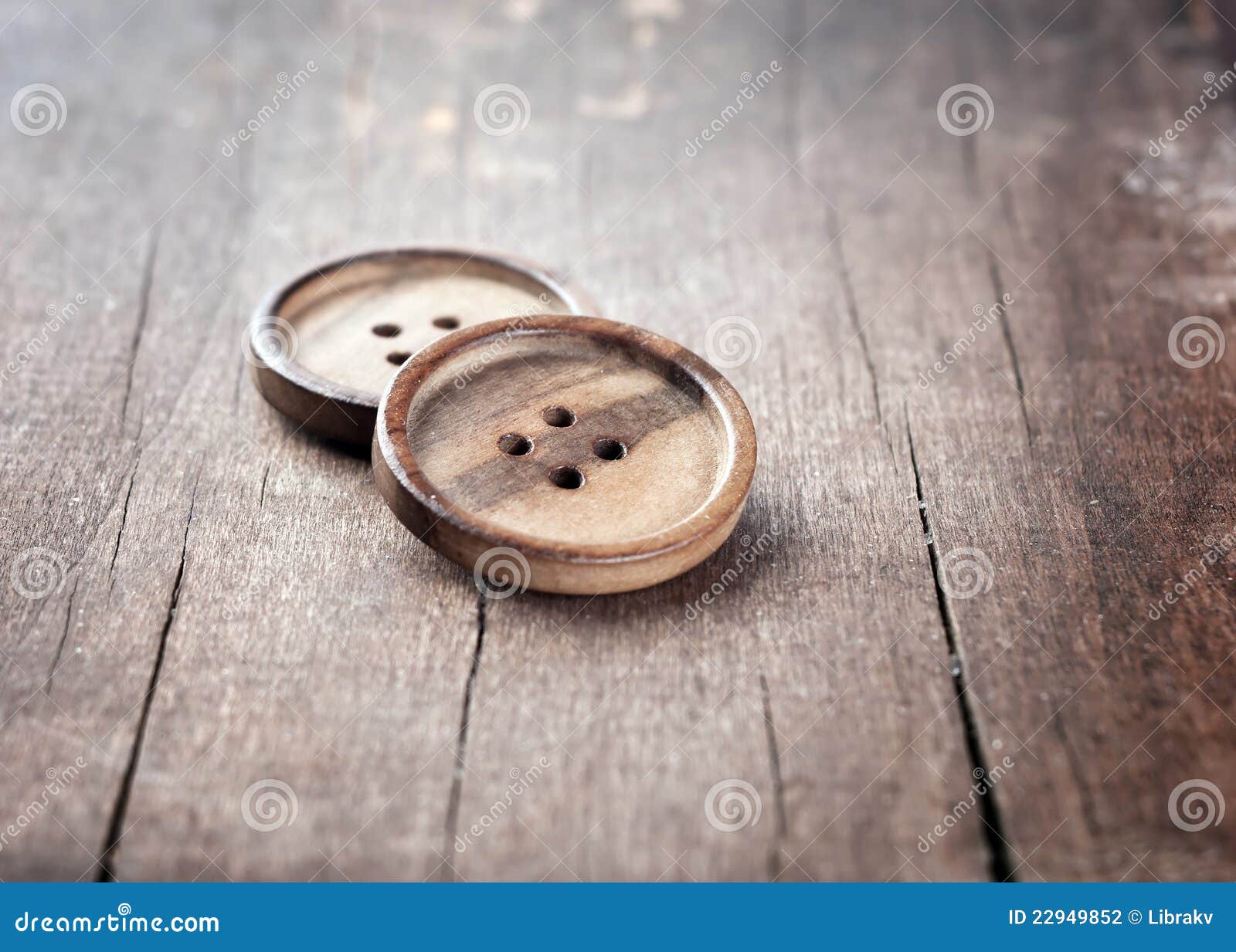 Button on a wooden table stock photo. Image of object - 22949852