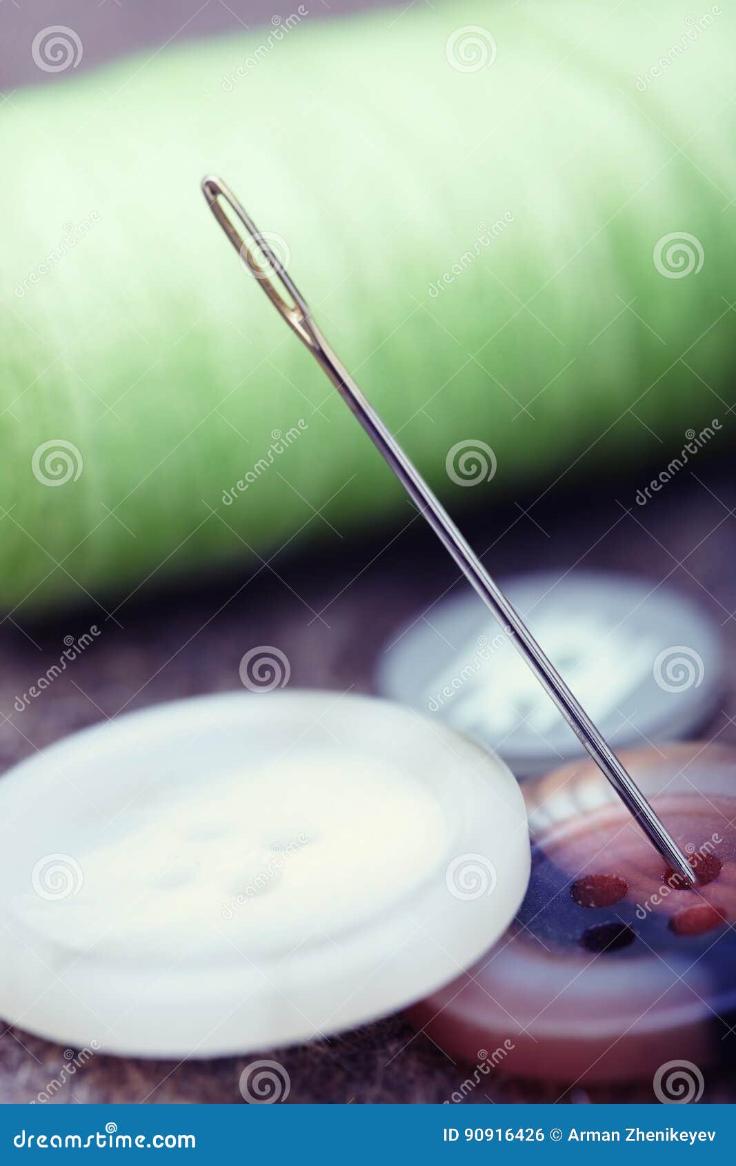 Buttons and sewing needle stock photo. Image of metal 90916426