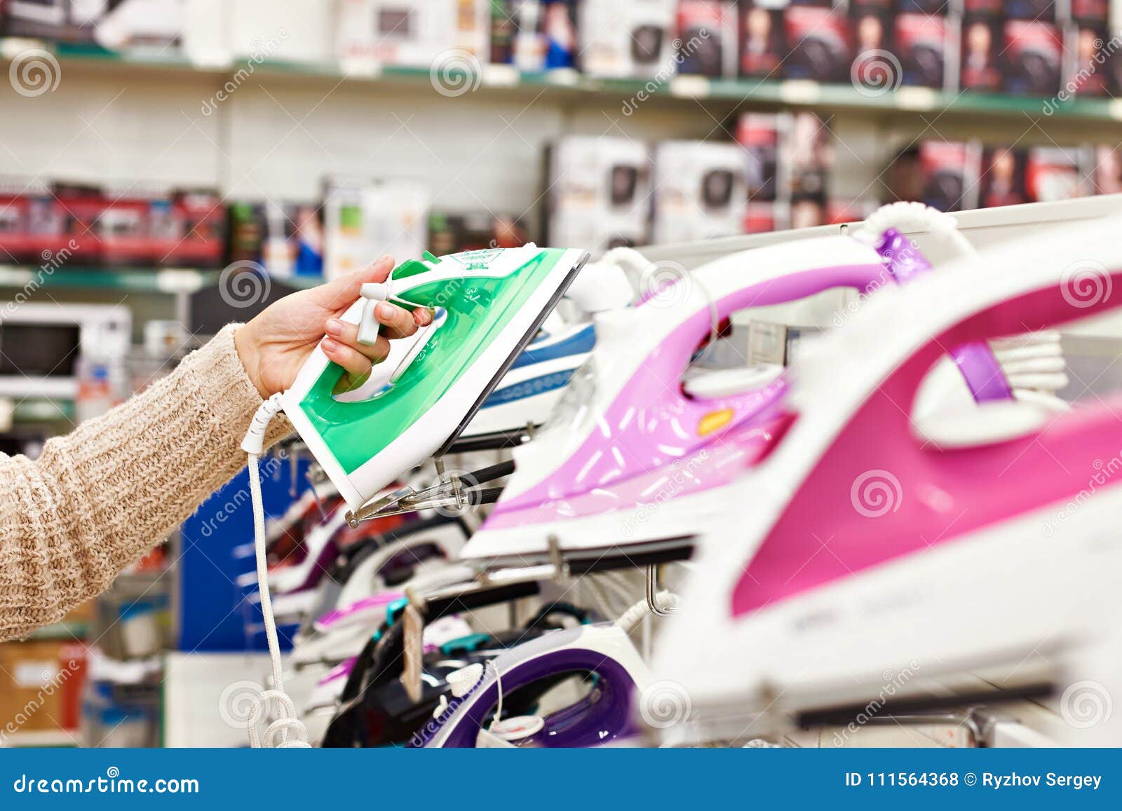 Buyer Chooses Modern Iron in Store Stock Photo Image of hypermarket