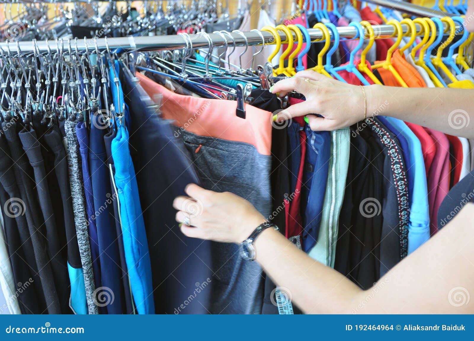 The Buyer Selects Clothes in a Second-hand Store Stock Photo - Image of ...
