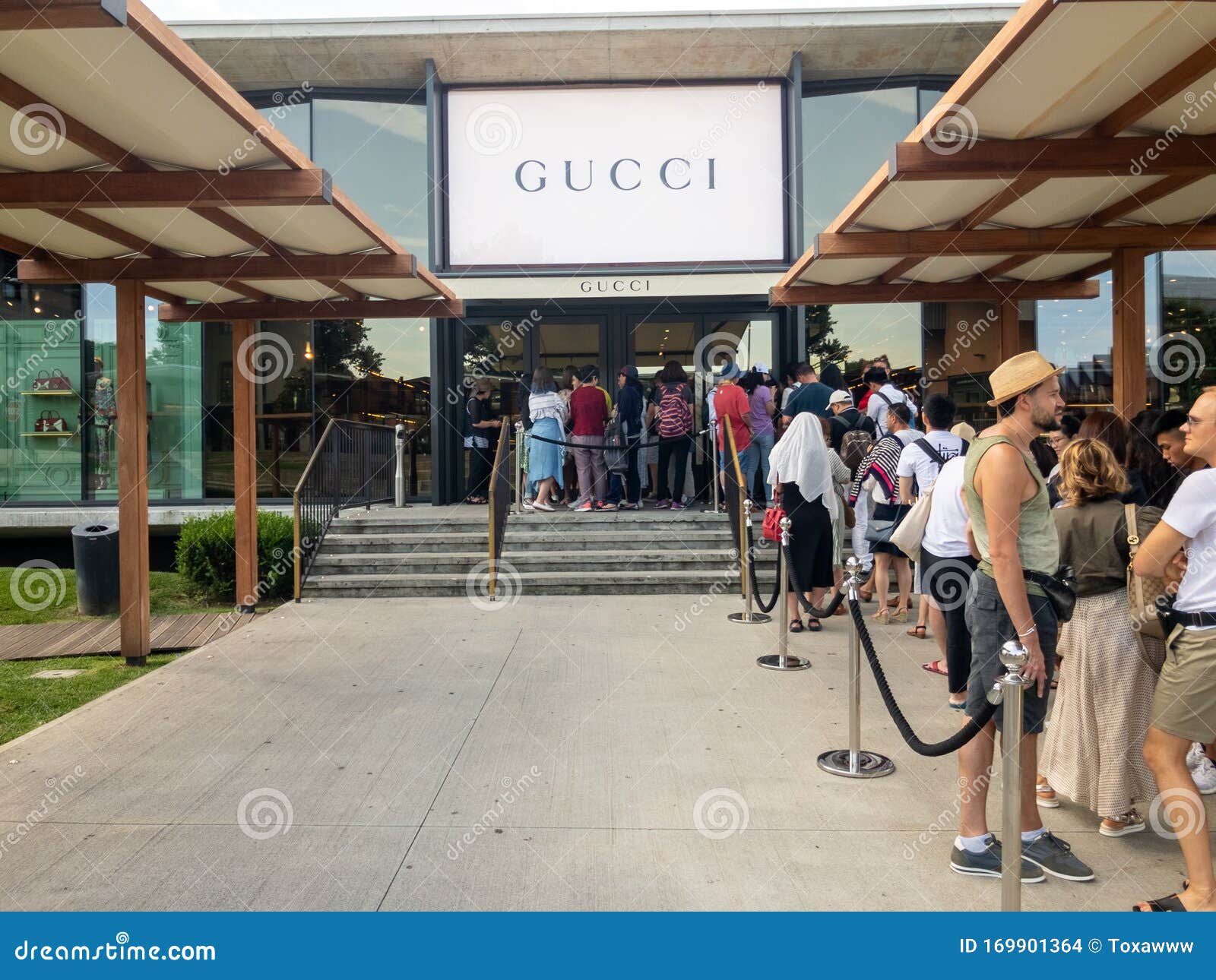 Buyers Waiting In Line To Visit Gucci Outlet During Sale Time Editorial Stock Image - Image of ...