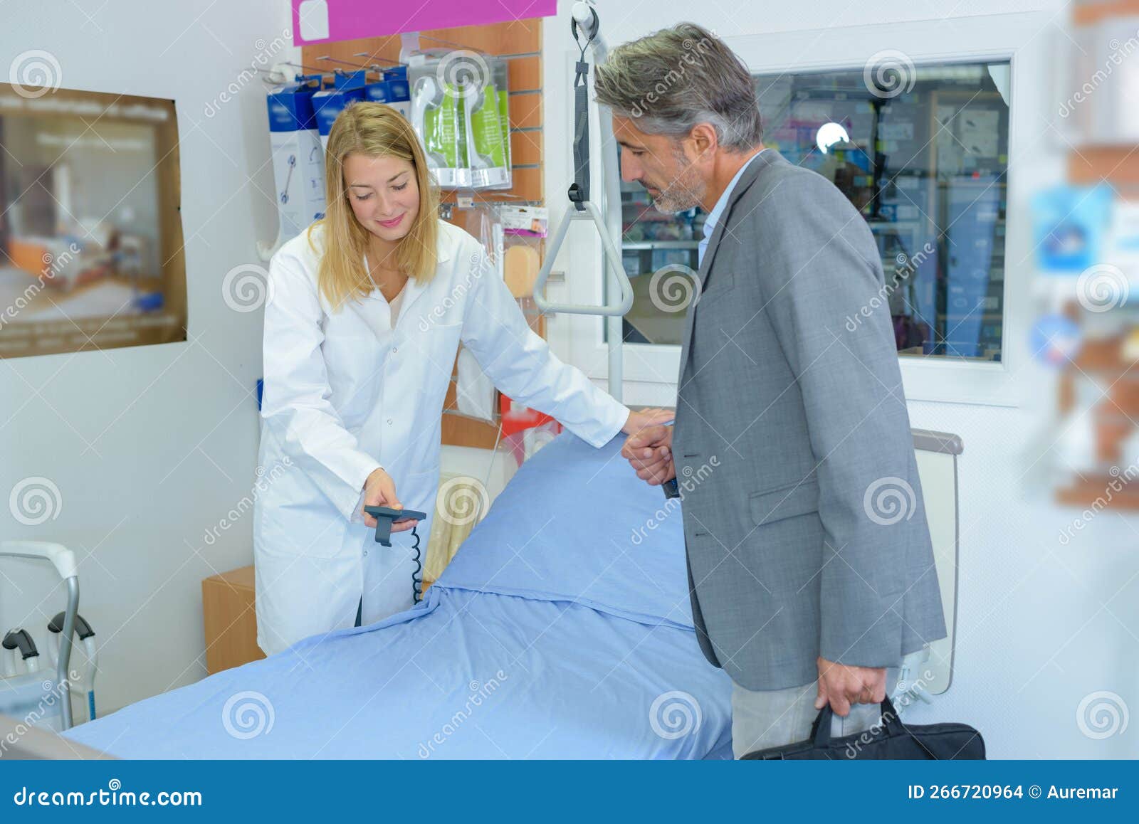 He buying medical bed stock photo. Image of inspect 266720964
