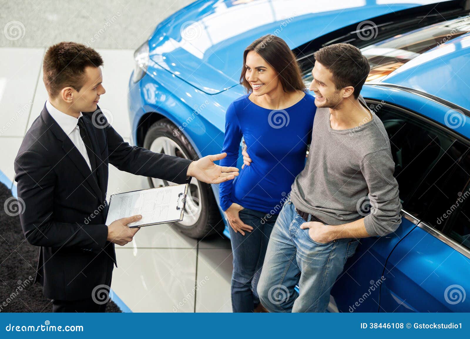 Buying Their First Car Together. Stock Photo Image of owner, indoors