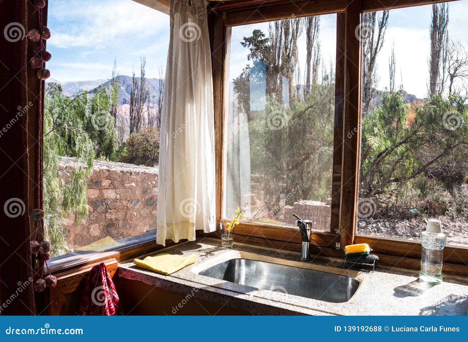 Windows With Outdoor Mountain View On A Corner Kitchen Stock Photo