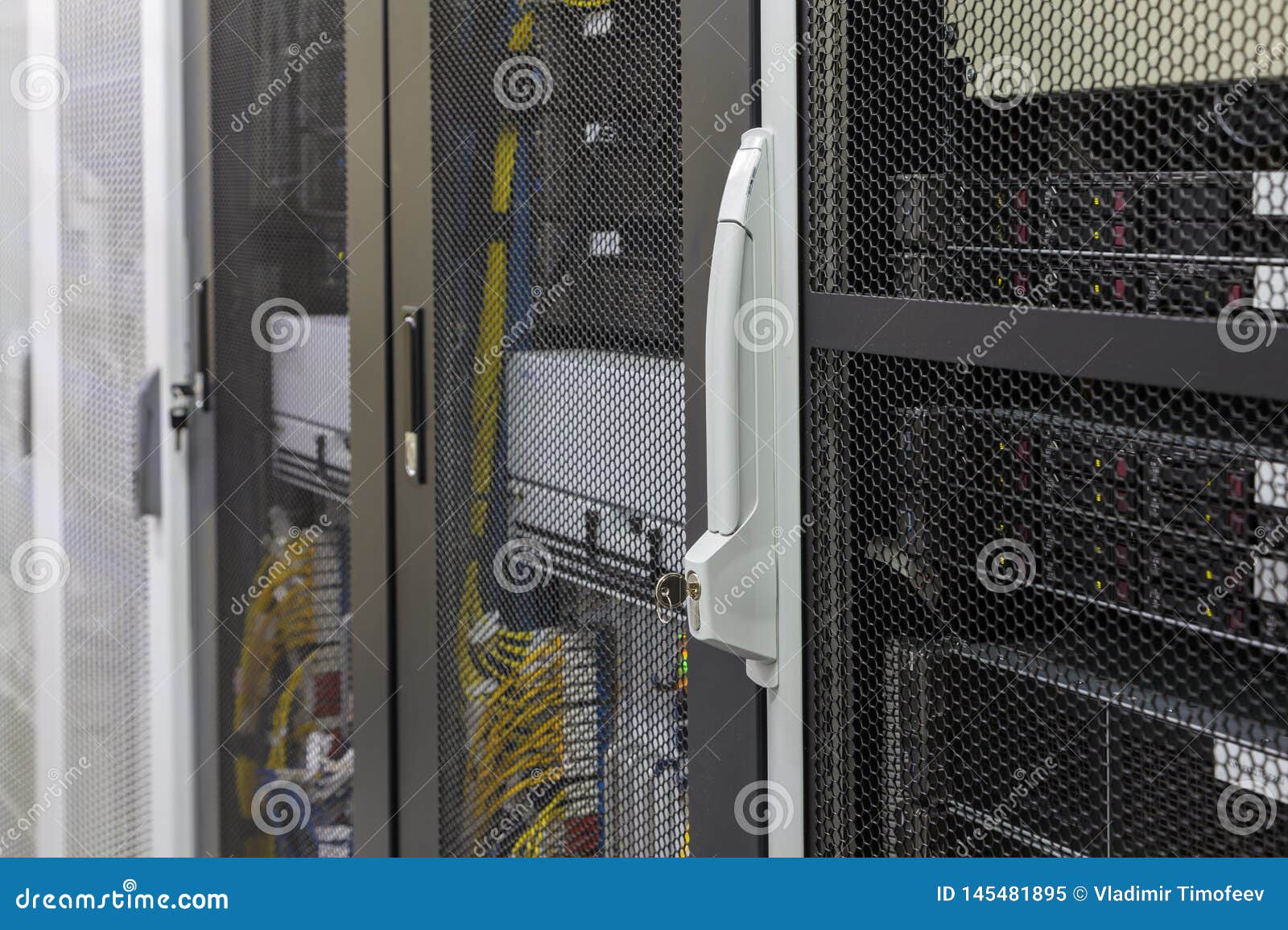 Cabinet In Data Center With Server Computers Switches Routers