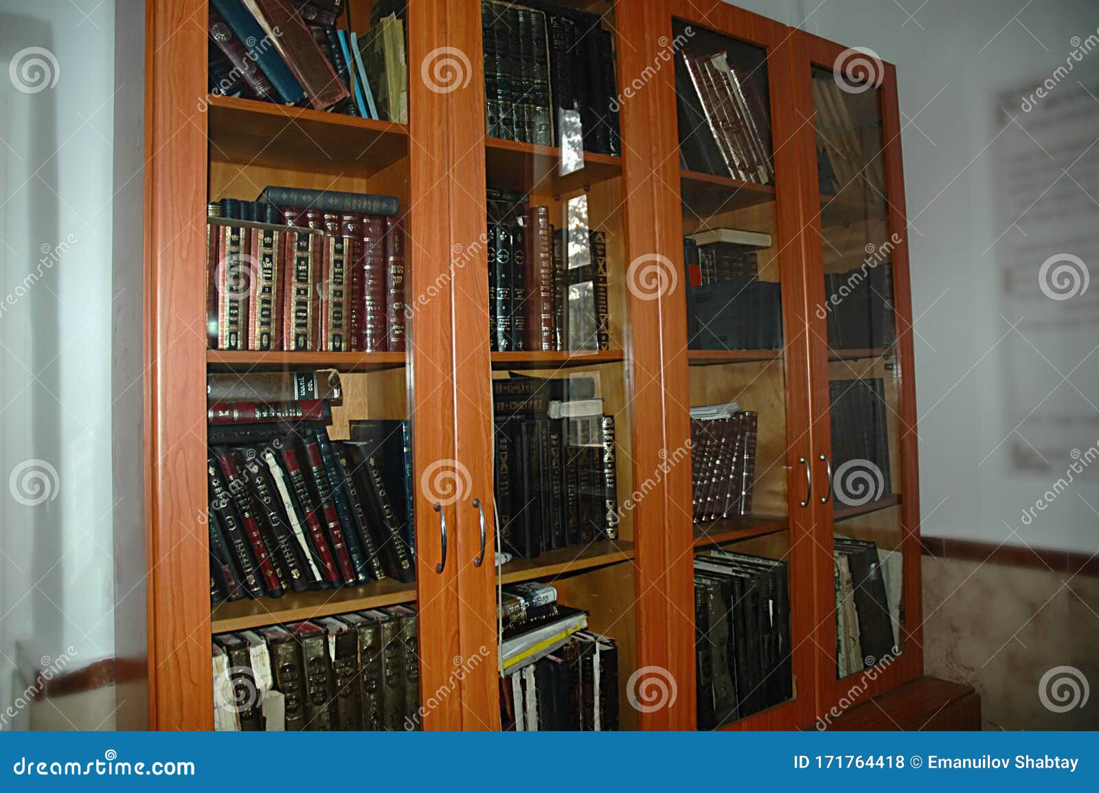 a cabinet with jewish holy books. torah, siddur, talmud, tanakh. synagogue in israel