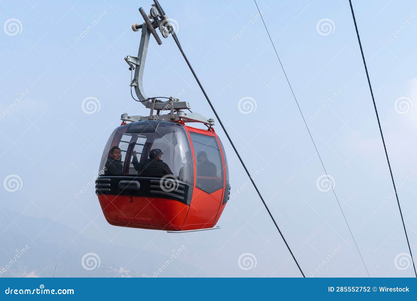Cable Car in Motion Against a Bright Blue Sky Editorial Photography