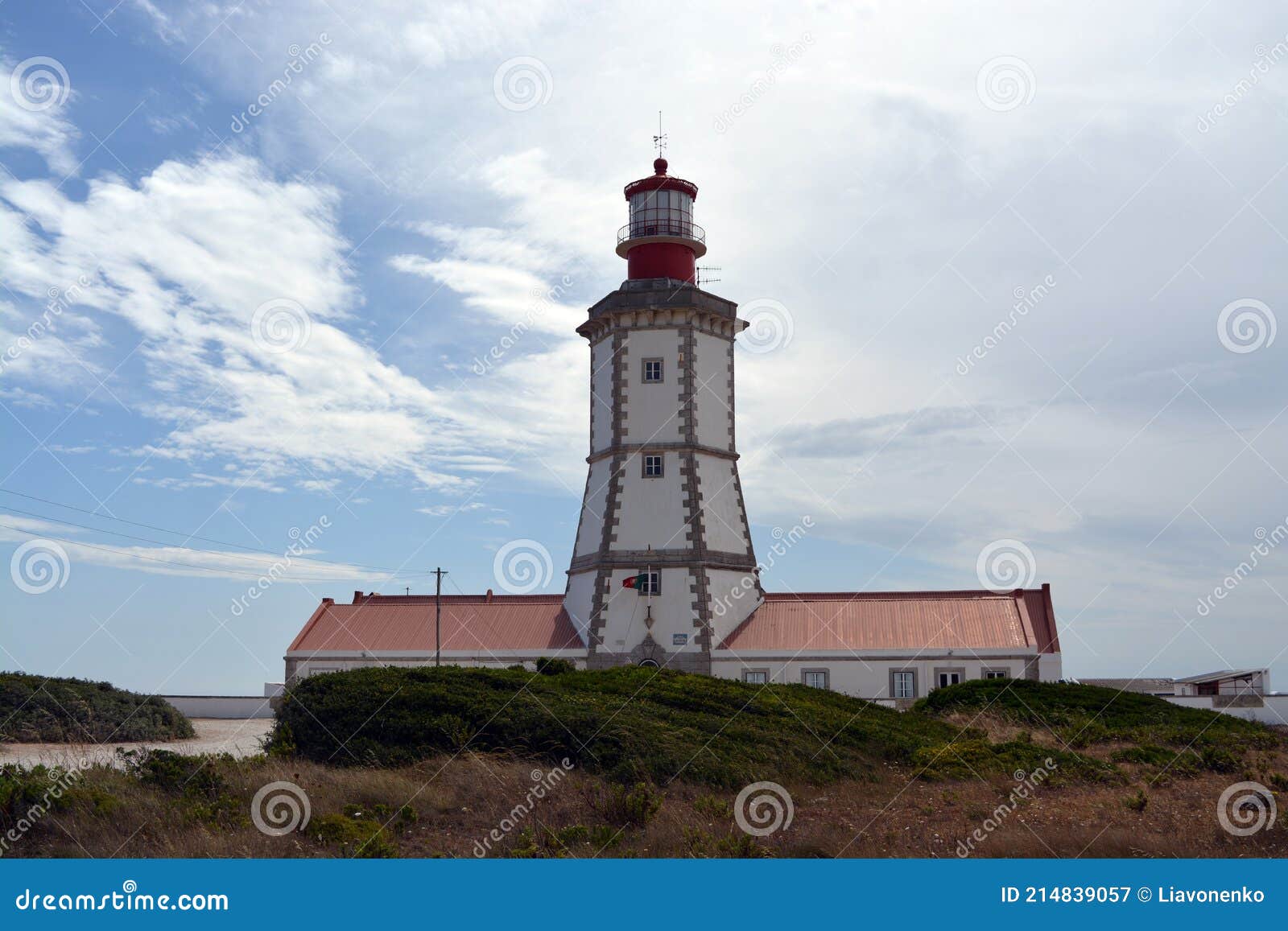 cabo espichel farol. especial cape lighthouse. portugal. landscape. shipping. help. sky. colorful background. blue red green white