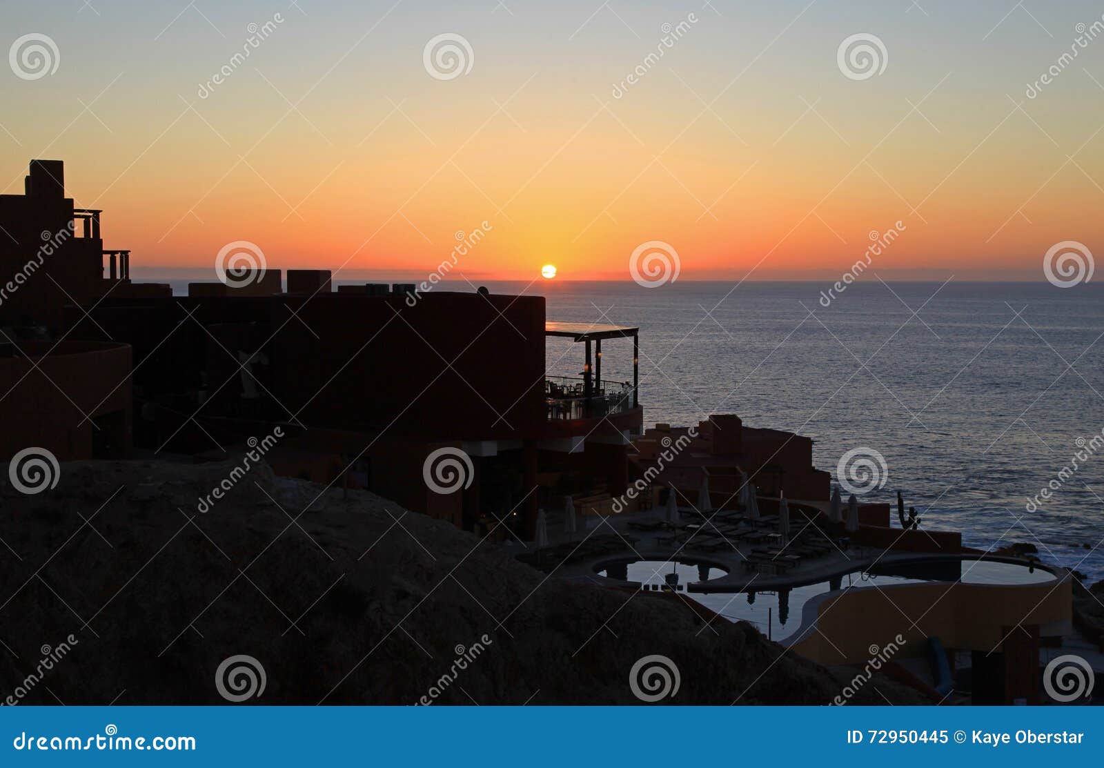Cabo San Lucas Club Regina at Sunset Stock Image - Image of ocean, wave