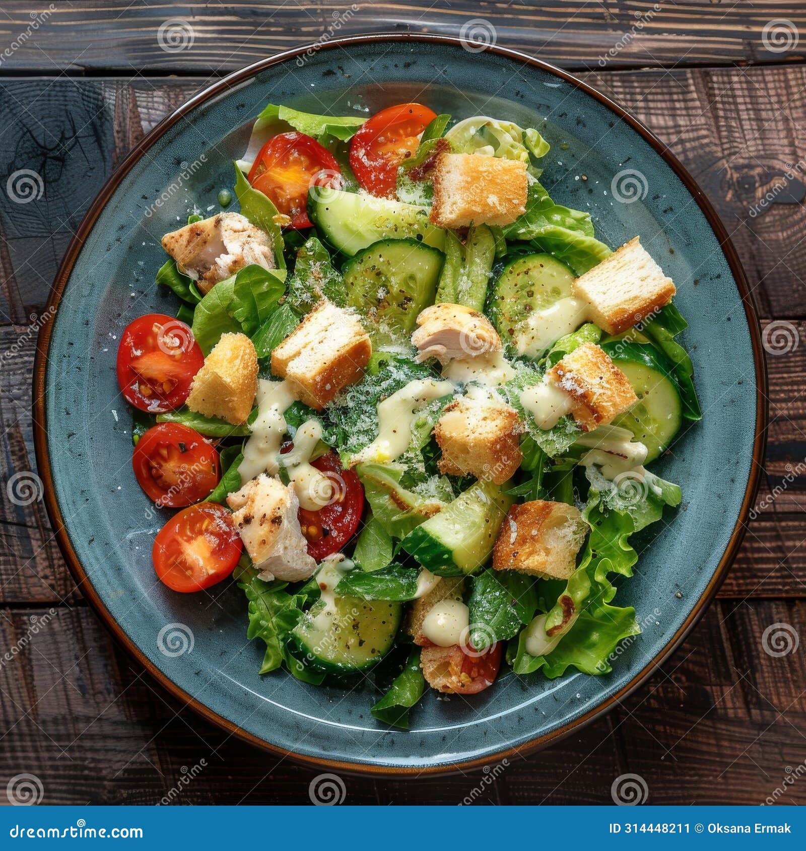 Caesar Salad with Chicken, Croutons, Tomatoes, Cucumbers on Blue Plate ...